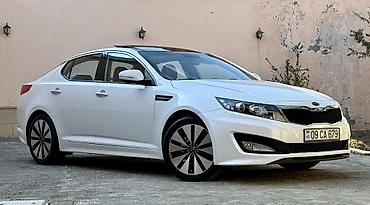 Kia: Kia Optima – ağ rəngli sedan Xarici xüsusiyyətlər: - Şık ağ kuzov — 5