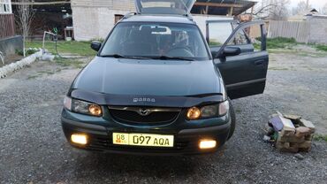 полик ош: Mazda Familia: 1998 г., Механика, Бензин