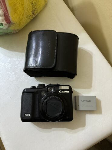 Fotokameralar: Canon G10 стaрый фотоаппарат. Уже cчитаeтся peтpo. Активно