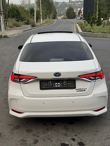 калпаки на диски: Toyota Corolla: 2021 г., Гибрид, Седан — 3