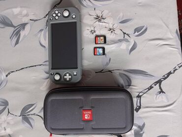 игровые консоли nintendo switch: Nintendo switch lite в отличном состоянии +7 игр загруженных и 2 игры