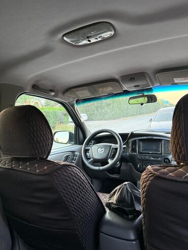 маленькая машина: Продается надежный внедорожник Mazda Tribute серебристого цвета
