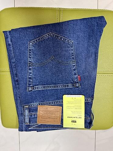 Джинсы: Levi’s 512 Slim Taper — мужские джинсы с заужением к низу. - Линия — 6
