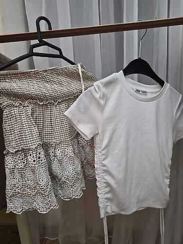 cins dest: Qadın geyim dəsti və ayrı-ayrı elementlər birlikde 20m 1) Ağ T-shirt — 1
