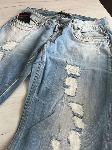 kickers 38: Muške farmerke – svetloplavi isprani teksas sa “distressed”/pocepanim — 1