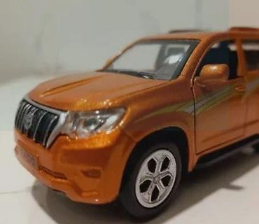 oyuncaq 2107: Metalik narıncı rəngdə Land Cruiser Prado mini model avtomobil — 2