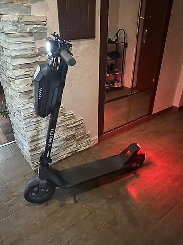 skuter xiaomi: Xiaomi elektrik skuter. Şəkillərdə qara rəngli, minimalist dizayna — 7