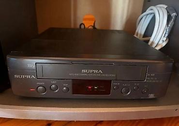 kaset calar: SUPRA VHS videomaqnitofon - Model: SUPRA SV-95R (ön panel üzərində — 2