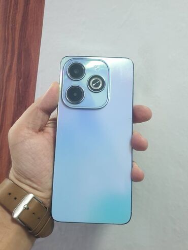 telefonlar a23: Infinix Hot 40, 128 GB, rəng - Göy, Zəmanət, Düyməli, Simsiz şarj