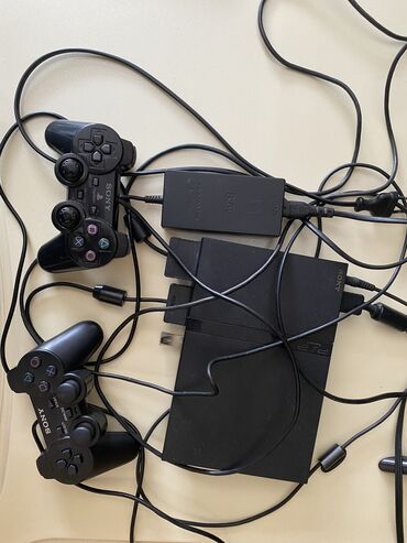 Video oyunlar və konsollar: Playstation2.Fleşka ilə işləyir,istədiyiniz oyunu yazıb -silmək olur
