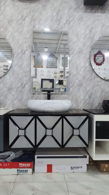 Ev üçün digər mebel: Ağ rəngli, mərmər naxışlı, oval formalı lavabo qara kranla