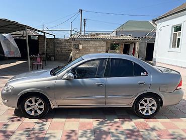 masin cip: Nissan Sunny: 1.6 l | 2008 il Sedan — 4