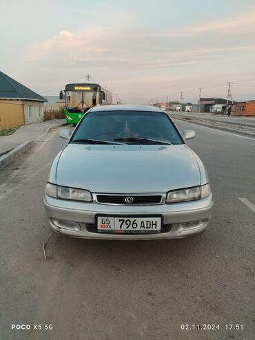 уна тетиктер: Mazda Cronos: 1995 г., 2 л, Механика, Бензин, Хетчбек