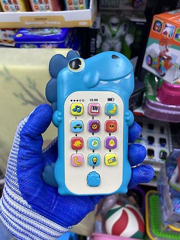 динозавр игрушка: Детский музыкальный телефон-игрушка в форме динозаврика. Яркая — 1