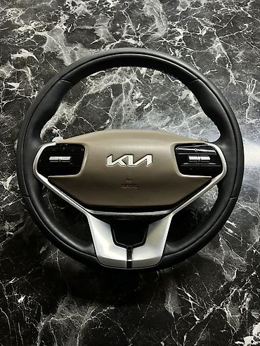 общивка руля: Руль Kia с подушкой безопасности (AIRBAG) и мультирулевыми кнопками — 1