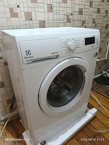 dikiş maşınları: Electrolux CompactCare paltaryuyan maşın. Öndən yükləməli modeldir — 3