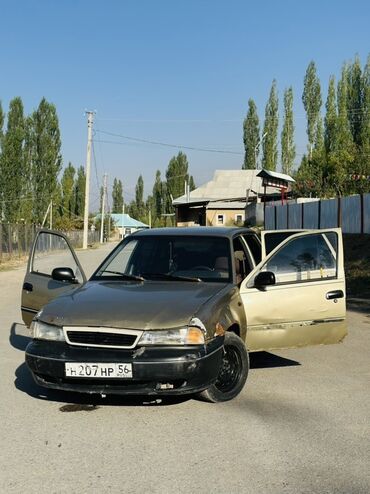купить кожаные сиденья для авто бу: Автомобиль Daewoo Nexia с кузовом седан, выполненный в золотистом