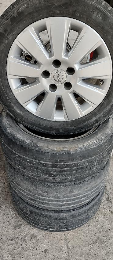 olu purjun: Opel üçün orijinal 16" yüngül lehimli disk və 205/55 R16 ölçülü — 1