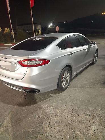ford: Ford Fusion sedan satılır. Avtomobil gümüşü rəngdədir və zərif — 9