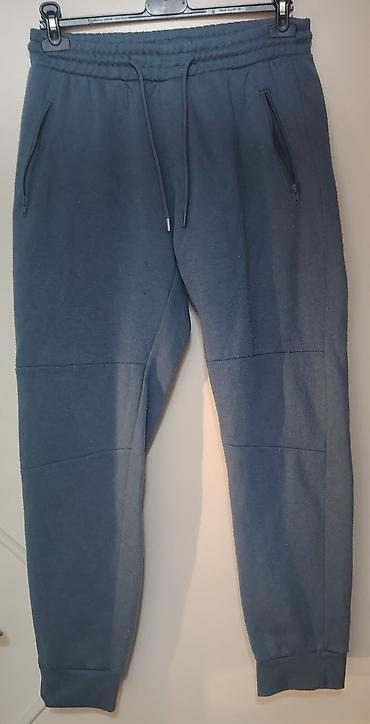 golmanske pantalone: Muške trenerka-pantalone, tamnoplave boje. - Model: jogger kroj sa — 1