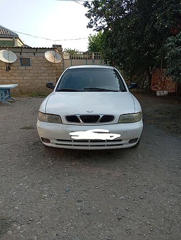 Daewoo: Daewoo Nubira sedan - Kuzov: 4 qapılı sedan, ağ rəng - Ban dizaynı — 6