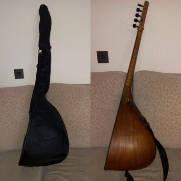 Gitaralar: Təmiz qoz ağacınandır heç bir problemi yoxdur 550m Ünvana şəhər içi