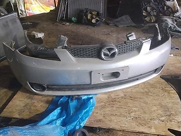 Передний бампер Mazda 3 (BK), дорестайлинг. - Оригинал, серебристый