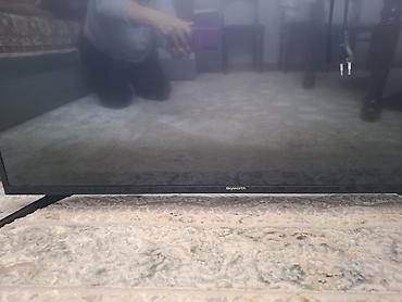 ps4 pro kg: Телевизор Skyworth, диагональ примерно 43–50". Тонкие рамки — 4