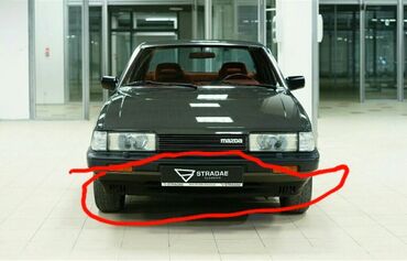 запчасть на мазду: Передний Бампер Mazda 1986 г.