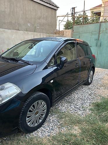 Транспорт: Nissan Tiida: 1.5 л | 2011 г. Хэтчбэк — 1