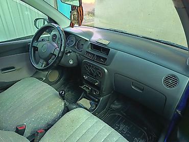 авто бак: Daihatsu Cuore: 2003 г., Механика, Бензин, Хэтчбэк — 5