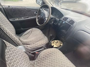mazda 2000: Mazda 323: 2001 г., 1.6 л, Механика, Бензин, Универсал — 5