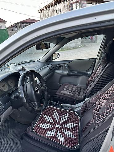 жук жабан: Mazda Familia: 2003 г., 1.6 л, Механика, Бензин, Универсал — 4