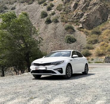 кия к5 бензин: Белый седан Kia Optima с современным дизайном кузова. Модель оснащена