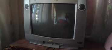 tcl телевизоры: ЭЛТ-телевизор LG в серебристом корпусе, оснащенный фронтальными