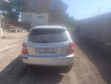 фаркоп рх: Mazda 323: 1999 г., 1.5 л, Механика, Универсал — 1