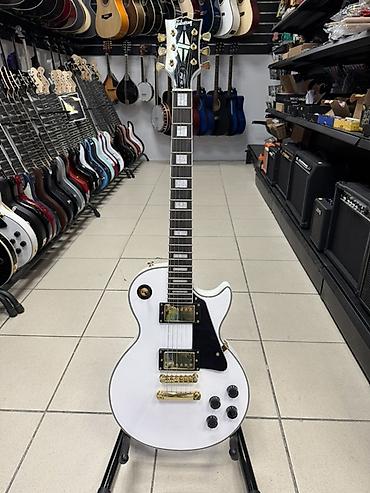 Музыкалык аспаптар: Электрогитара типа Les Paul с двумя хамбакерами и фирменной эстетикой — 2