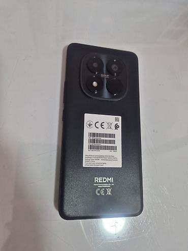 redmi 13 x: Redmi smartfon - Arxa paneldə “REDMI” loqosu və çoxmodullu kamera — 2