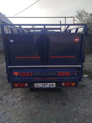 smart open: Hyundai Porter — компактный бортовой грузовик синего цвета. Основные — 6