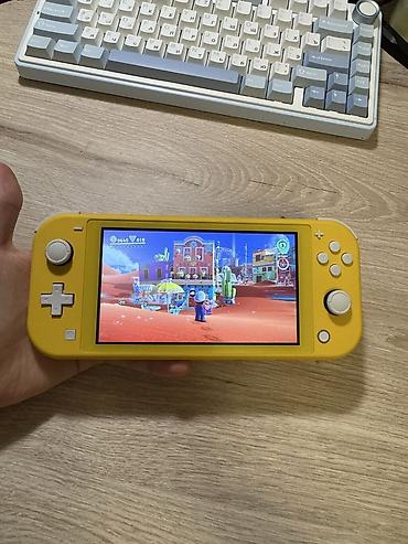 nintendo switch lite ikinci el: Nintendo Switch Lite oyun konsolu, ideal veziyyetdedir, seliqeli — 5
