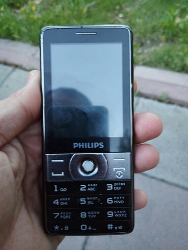 philips 1520: Philips W7555, цвет - Черный, Кнопочный, Две SIM карты