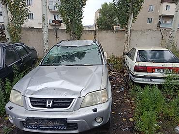 Унаа: Honda CR‑V I (рестайлинг), серебристый кроссовер 5‑дв. По кузову — 3