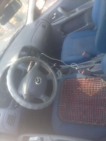 аудио касета: Mazda 323: 2000 г., Механика, Бензин — 6