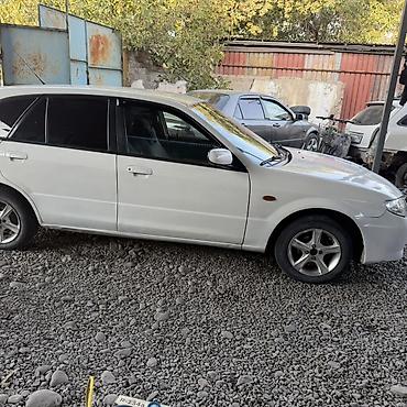 универса: Mazda Familia: 1999 г., 1.6 л, Механика, Бензин, Универсал — 5