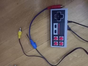 islenmis mator: Klassik NES üslubunda retro oyun konsolu. Dəstdə konsol, bir ədəd oyun — 1