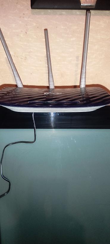 modem ustası: TP-Link Wi‑Fi marşrutizatoru (3 antenalı) - Model: Archer seriyasına — 4