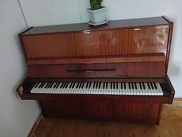 Musiqi alətləri: Dik piano – klassik üslubda akustik upright model. Xüsusiyyətlər: - — 3