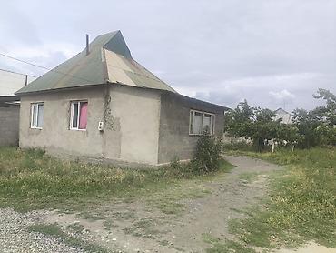 Дом с приусадебным участком. - Одноэтажный жилой дом из блока/кирпича