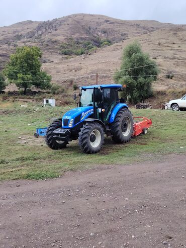 диски на зимнюю резину фольксваген: New Holland mavi rəngli kənd təsərrüfatı traktoru və arxa asqıda