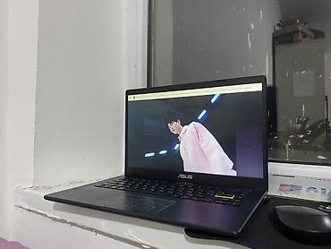 Ноутбуки ASUS: Ноутбук ASUS - Тонкий корпус, тёмно-синий цвет, логотип ASUS на — 1